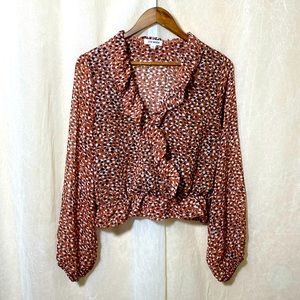 Steve Madden blouse is brown with black and white print size Large
